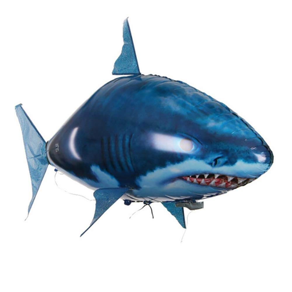 Remote control flying shark toy in blue, hovering mid-air, ideal for indoor play and home parties.