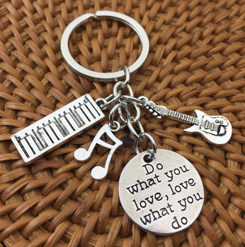 Music Keychain with Piano Guitar Saxophone Design
