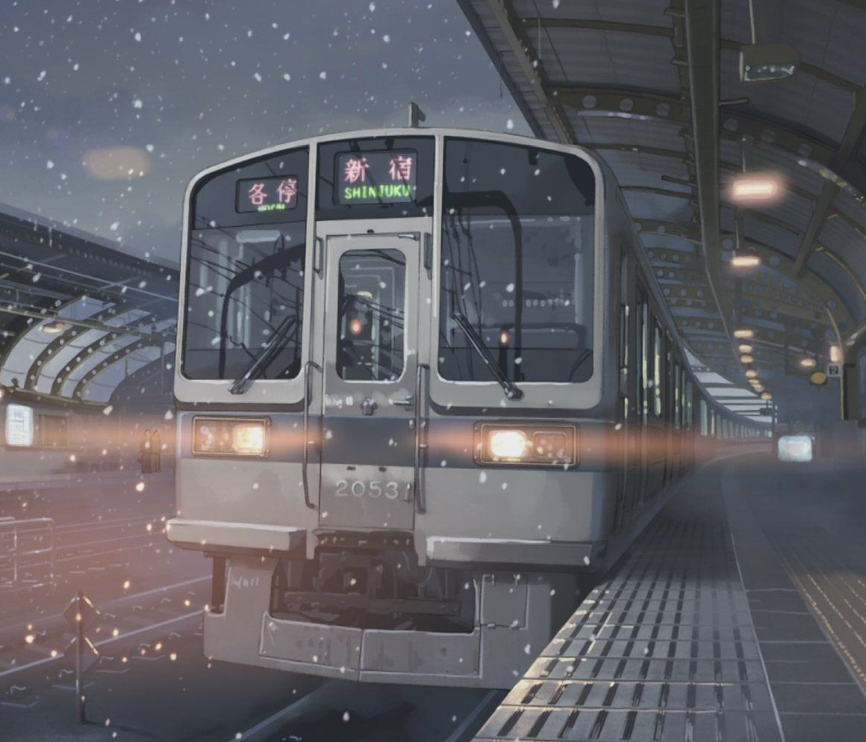 Snowy train at the station with a focus on toy train sets, highlighting the charm of model trains in winter.