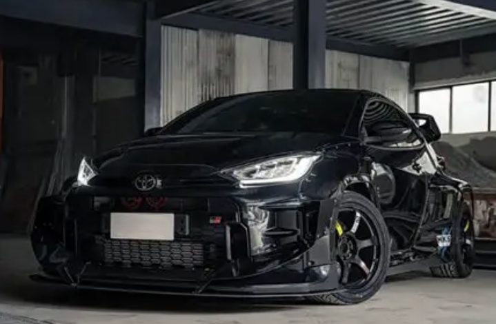 Toyota car parts collection featuring a modified black Toyota car with sleek design.