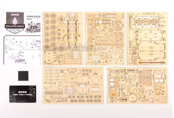 Detailed components of a 3D steam train puzzle toy, showcasing precision-cut pieces for assembly.
