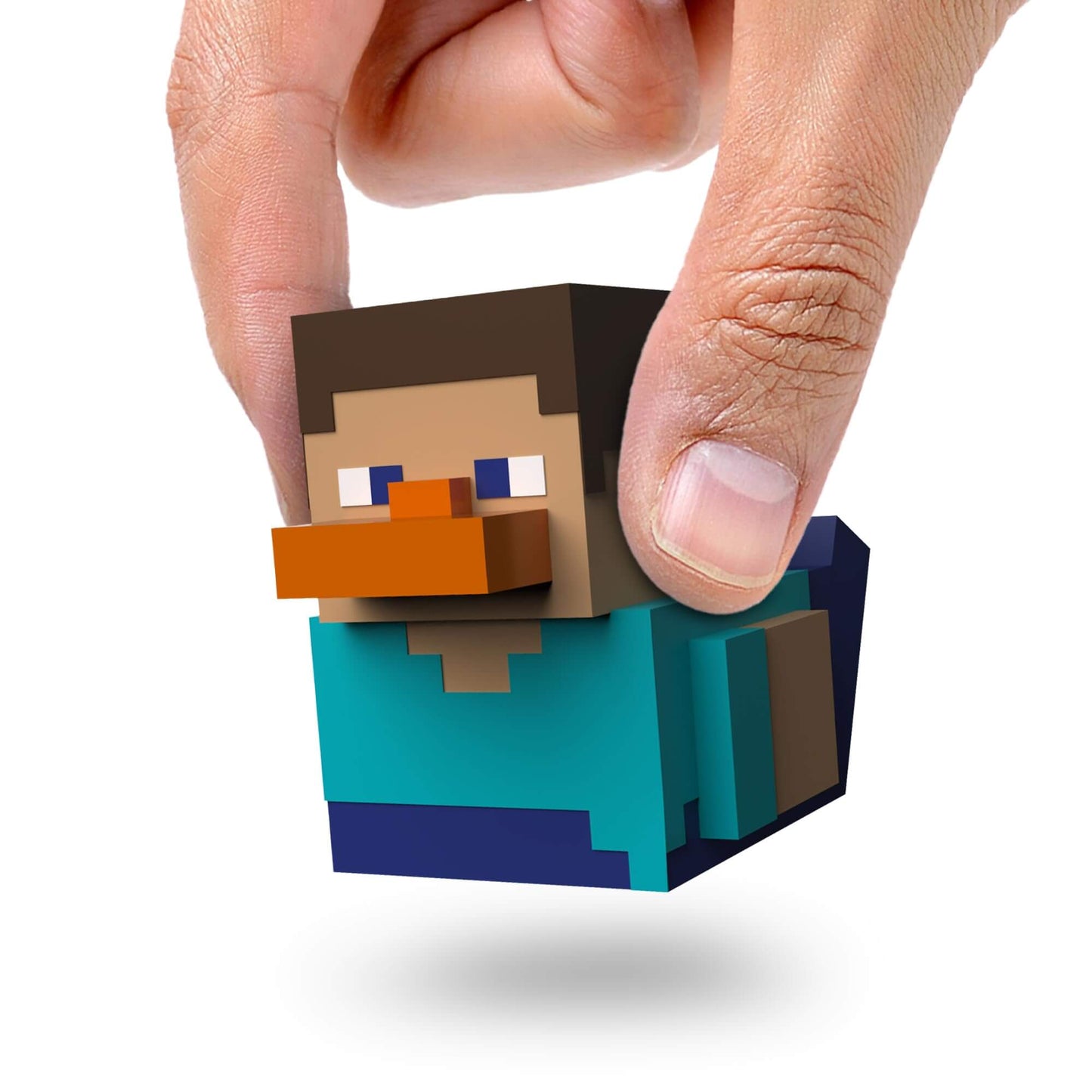 Minecraft collectible rubber duck being held by a finger, featuring a cute Steve character design.