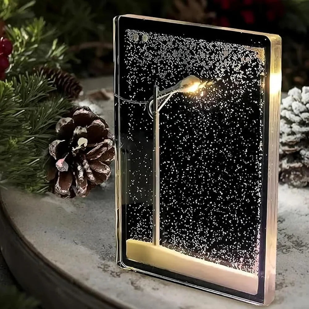 Handmade snow scene night light featuring a street lamp and falling snow in a decorative package.