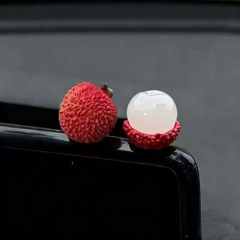 Personalized and creative cartoon car decorations on the center console, simulating orange and lychee car decorations