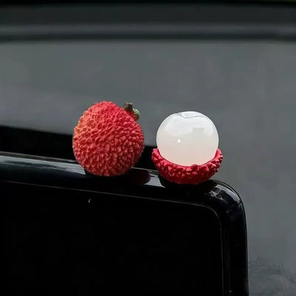 Personalized and creative cartoon car decorations on the center console, simulating orange and lychee car decorations