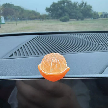 Personalized and creative cartoon car decorations on the center console, simulating orange and lychee car decorations