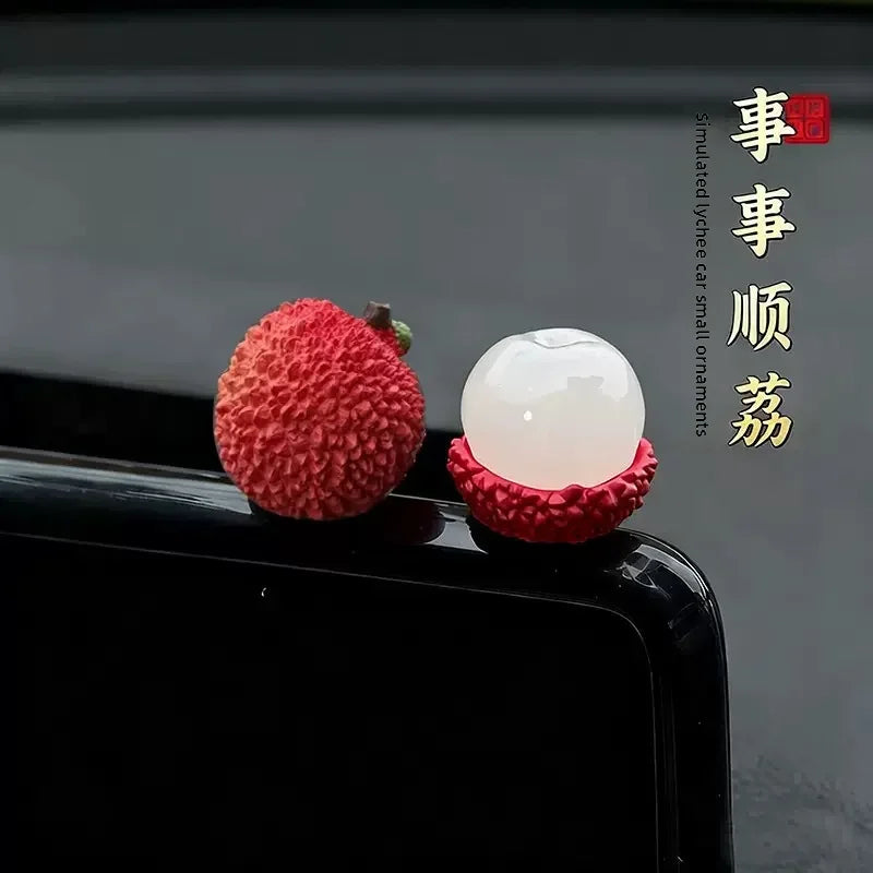 Personalized and creative cartoon car decorations on the center console, simulating orange and lychee car decorations