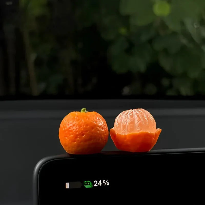 Personalized and creative cartoon car decorations on the center console, simulating orange and lychee car decorations