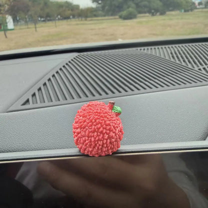 Personalized and creative cartoon car decorations on the center console, simulating orange and lychee car decorations