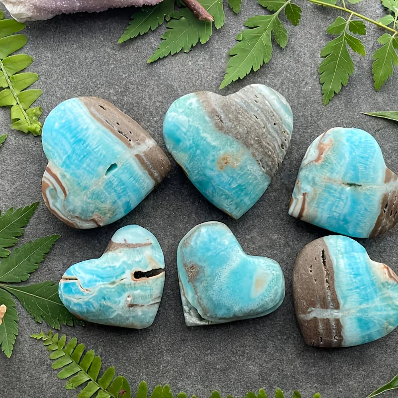 A natural, random Caribbean heart-shaped stone is suitable as a crystal collectible gift.