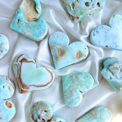 A natural, random Caribbean heart-shaped stone is suitable as a crystal collectible gift.