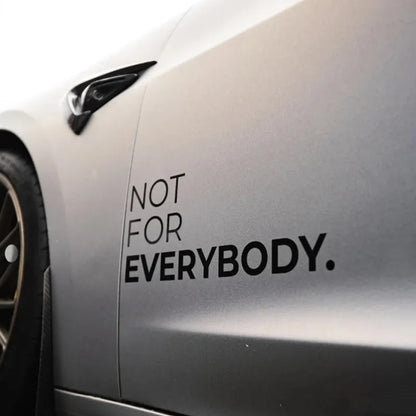 Personalized JDM car door stickers on a car with the text 'NOT FOR EVERYBODY.' in black, glossy finish.