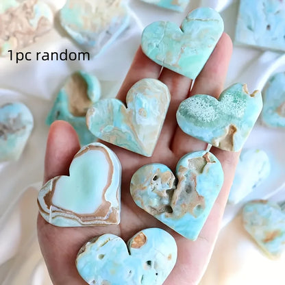 A natural, random Caribbean heart-shaped stone is suitable as a crystal collectible gift.