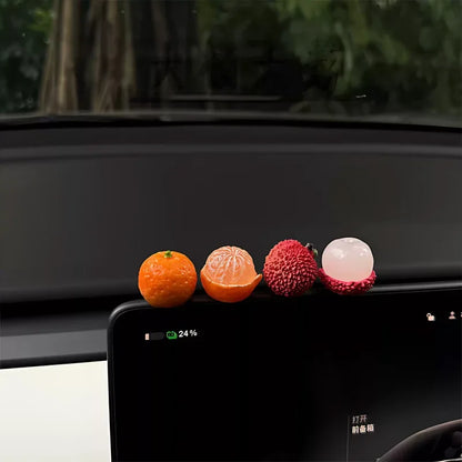 Personalized and creative cartoon car decorations on the center console, simulating orange and lychee car decorations