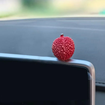 Personalized and creative cartoon car decorations on the center console, simulating orange and lychee car decorations