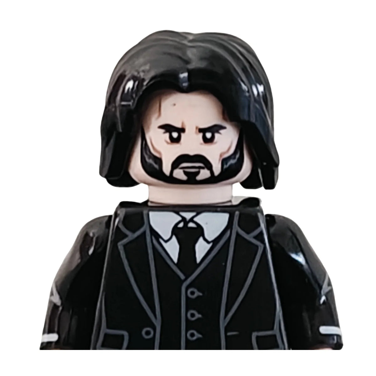 John Wick action figure building blocks mini figure with a black suit and detailed facial features.