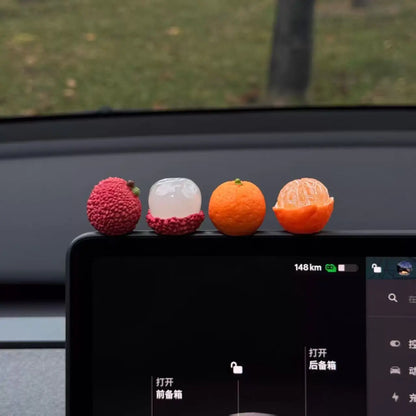 Personalized and creative cartoon car decorations on the center console, simulating orange and lychee car decorations
