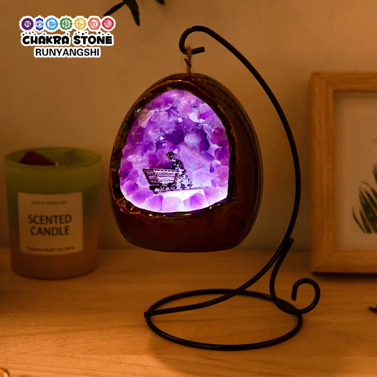 Natural amethyst dinosaur egg lamp illuminating a cozy space on a bedside table.