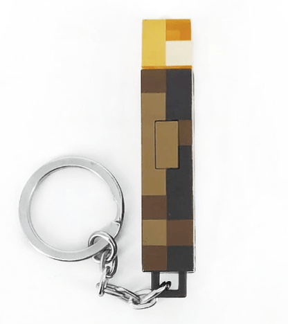 Minecraft torch keychain showcasing its blocky design with a keyring attachment for fans.